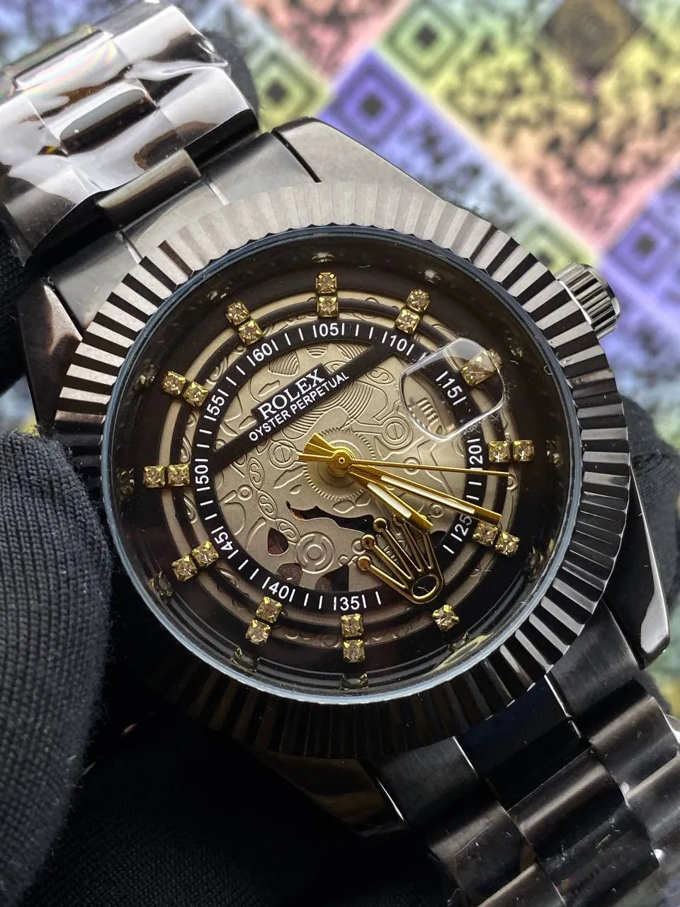 Close-up of a Rolex watch with a detailed face against a colorful geometric pattern background.